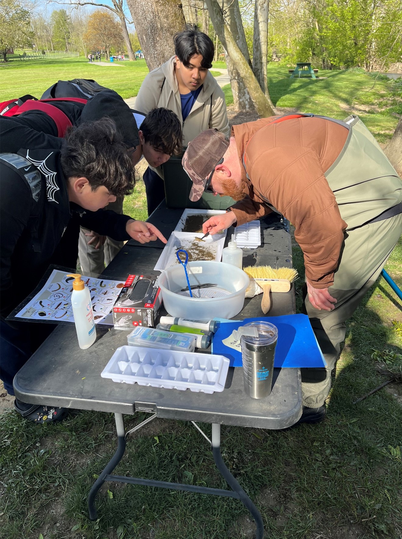 A city employee leading a demonstration of identifying life found in the local rivers and streams.